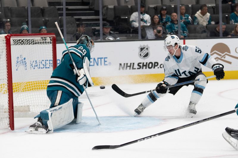 Oct 1, 2024; San Jose, California, USA;  Utah Hockey Club forward Kailer Yamamoto (56) shoots the puck past San Jose Sharks goaltender Mackenzie Blackwood (29) during the third period at SAP Center at San Jose. Mandatory Credit: Stan Szeto-Imagn Images
