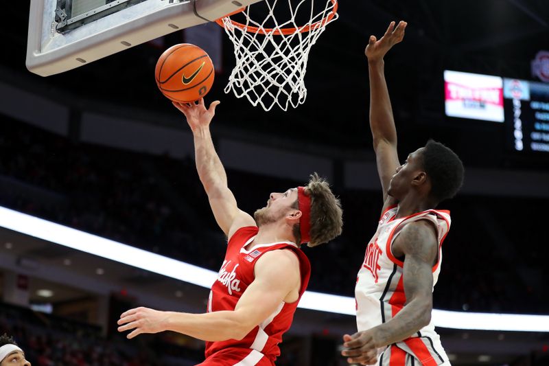 Feb 29, 2024; Columbus, Ohio, USA;  Nebraska Cornhuskers guard Sam Hoiberg (1) shoots against Ohio State Buckeyes guard Dale Bonner (4) during the first half at Value City Arena. Mandatory Credit: Joseph Maiorana-USA TODAY Sports