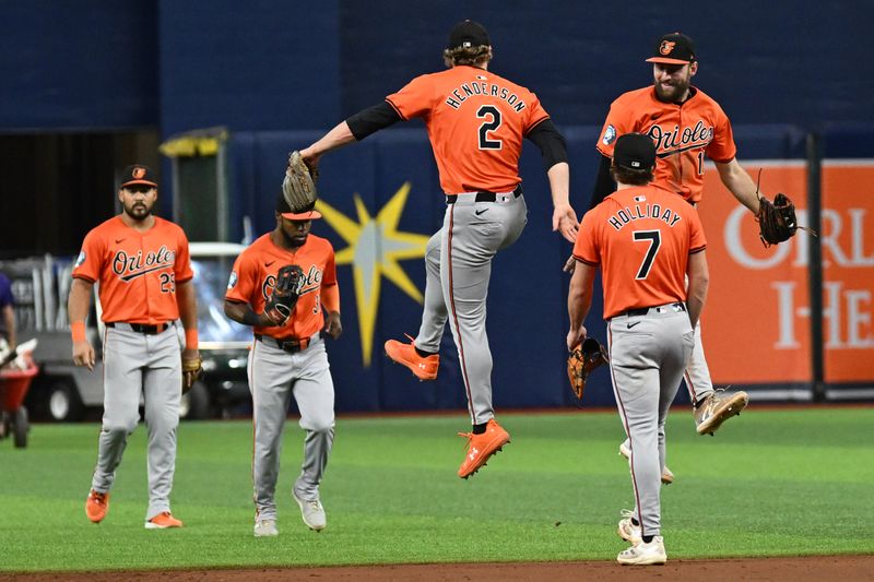 Aug 10, 2024; St. Petersburg, Florida, USA; Baltimore Orioles shortstop Gunnar Henderson (2) and  left fielder Colt Cowser (17) celebrate after defeating Tampa Bay Rays at Tropicana Field. Mandatory Credit: Jonathan Dyer-USA TODAY Sports