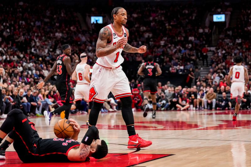 TORONTO, ON - APRIL 12: DeMar DeRozan #11 of the Chicago Bulls reacts after fouling Fred VanVleet #23 of the Toronto Raptors during the 2023 Play-In Tournament at the Scotiabank Arena on April 12, 2023 in Toronto, Ontario, Canada. NOTE TO USER: User expressly acknowledges and agrees that, by downloading and/or using this Photograph, user is consenting to the terms and conditions of the Getty Images License Agreement. (Photo by Andrew Lahodynskyj/Getty Images)