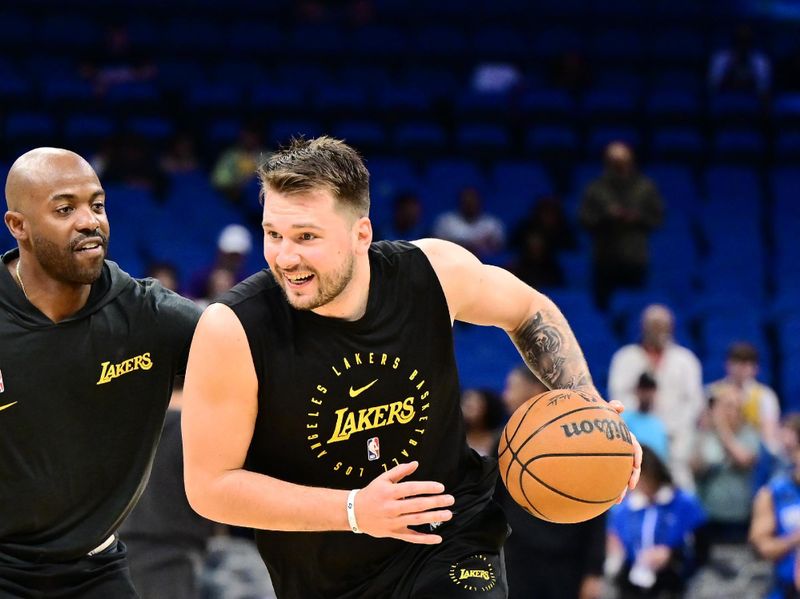 ORLANDO, FLORIDA - MARCH 24: Luka Doncic #77 of the Los Angeles Lakers warms up prior to a game against the Orlando Magic at Kia Center on March 24, 2025 in Orlando, Florida. NOTE TO USER: User expressly acknowledges and agrees that, by downloading and or using this photograph, User is consenting to the terms and conditions of the Getty Images License Agreement. (Photo by Julio Aguilar/Getty Images)