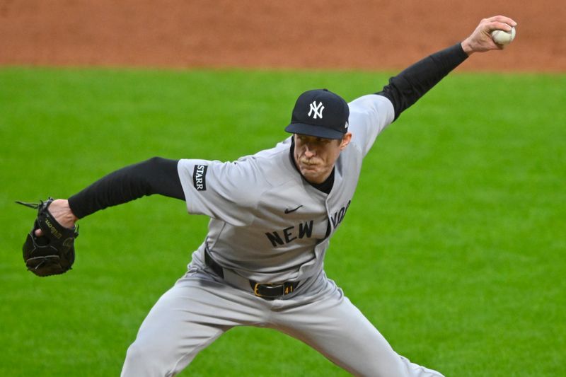 Apr 22, 2025; Cleveland, Ohio, USA; New York Yankees relief pitcher Tim Hill (41) delivers a pitch in the sixth inning against the Cleveland Guardians at Progressive Field. Mandatory Credit: David Richard-Imagn Images