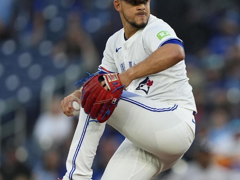 Sep 10, 2025; Toronto, Ontario, CAN; Toronto Blue Jays starting pitcher Jose Berrios (17) pitches to the Houston Astros during the first inning at Rogers Centre. Mandatory Credit: John E. Sokolowski-Imagn Images