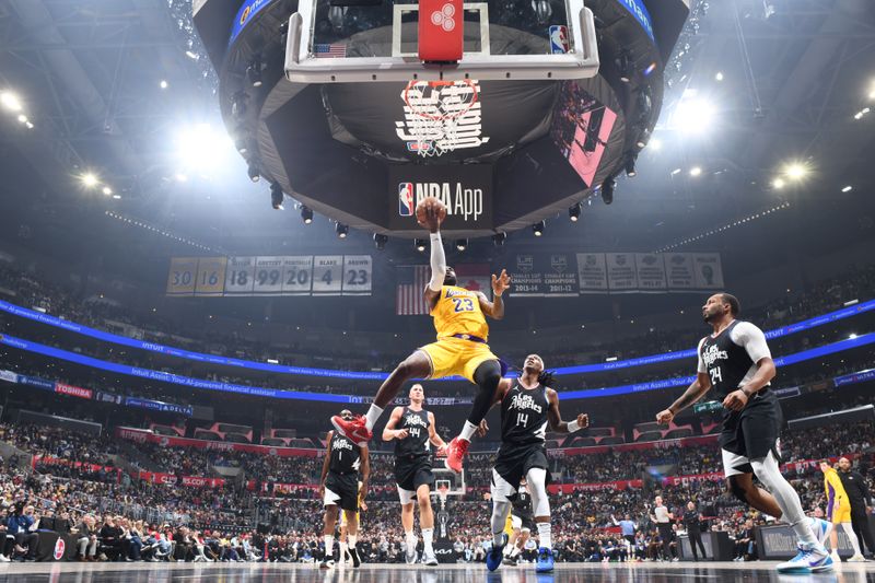 LOS ANGELES, CA - FEBRUARY 28: LeBron James #23 of the Los Angeles Lakers drives to the basket during the game against the LA Clippers on February 28, 2024 at Crypto.Com Arena in Los Angeles, California. NOTE TO USER: User expressly acknowledges and agrees that, by downloading and/or using this Photograph, user is consenting to the terms and conditions of the Getty Images License Agreement. Mandatory Copyright Notice: Copyright 2024 NBAE (Photo by Andrew D. Bernstein/NBAE via Getty Images)