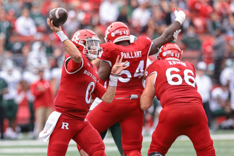 Oct 9, 2021; Piscataway, New Jersey, USA; Rutgers Scarlet Knights quarterback Noah Vedral (0) throws the ball as offensive lineman Cedrice Paillant (54) and offensive lineman Nick Krimin (66) block against the Michigan State Spartans during the second half at SHI Stadium. Mandatory Credit: Vincent Carchietta-USA TODAY Sports