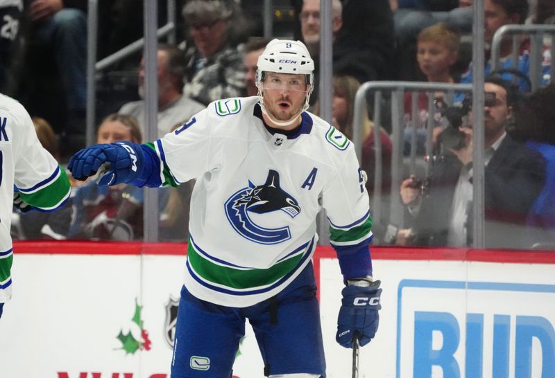 Nov 22, 2023; Denver, Colorado, USA; Vancouver Canucks center J.T. Miller (9) celebrates his goal in the second period against the Colorado Avalanche at Ball Arena. Mandatory Credit: Ron Chenoy-USA TODAY Sports