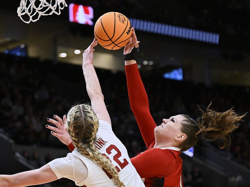 Mar 29, 2024; Portland, OR, USA; Stanford Cardinal forward Cameron Brink (22) blocks a shot during the first half against NC State Wolfpack center River Baldwin (1) in the semifinals of the Portland Regional of the 2024 NCAA Tournament at the Moda Center at the Moda Center. Mandatory Credit: Troy Wayrynen-USA TODAY Sports