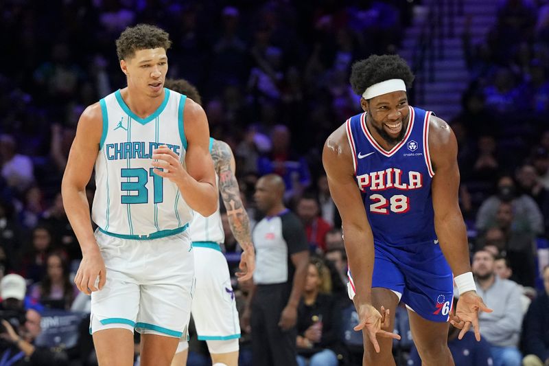 PHILADELPHIA, PENNSYLVANIA - NOVEMBER 10: Guerschon Yabusele #28 of the Philadelphia 76ers reacts in front of Tidjane Salaun #31 of the Charlotte Hornets in the second half at the Wells Fargo Center on November 10, 2024 in Philadelphia, Pennsylvania. The 76ers defeated the Hornets 107-105 in overtime. NOTE TO USER: User expressly acknowledges and agrees that, by downloading and/or using this photograph, user is consenting to the terms and conditions of the Getty Images License Agreement. (Photo by Mitchell Leff/Getty Images)