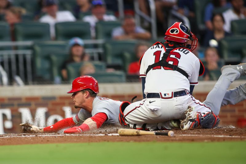 Sep 7, 2023; Atlanta, Georgia, USA; St. Louis Cardinals second baseman Nolan Gorman (16) scores past Atlanta Braves catcher Travis d'Arnaud (16) in the second inning at Truist Park. Mandatory Credit: Brett Davis-USA TODAY Sports