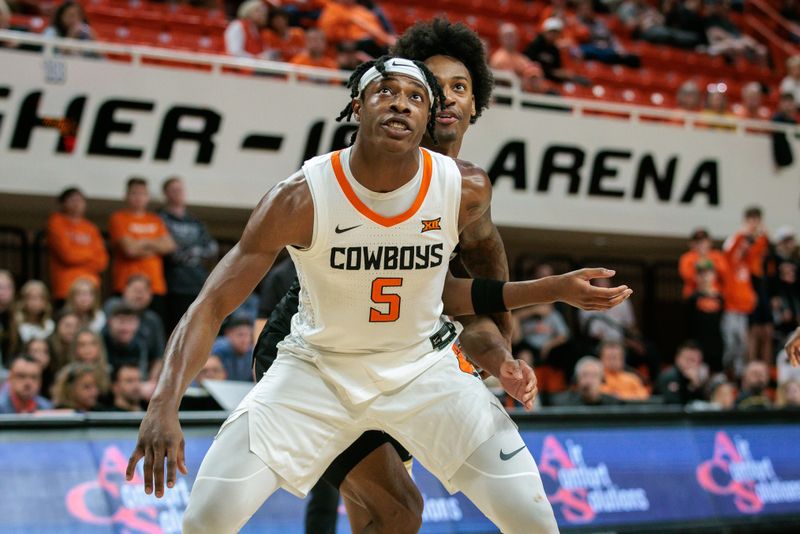 Dec 20, 2023; Stillwater, Oklahoma, USA; Oklahoma State Cowboys guard Quion Williams (5) blocks out Wofford Terriers guard Chase Martin (5) during the second half at Gallagher-Iba Arena. Mandatory Credit: William Purnell-USA TODAY Sports