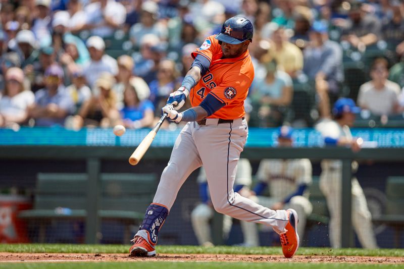 Jul 21, 2024; Seattle, Washington, USA; Houston Astros designated hitter Yordan Alvarez (44) hits a solo home run against the Seattle Mariners during the fourth inning at T-Mobile Park. Mandatory Credit: John Froschauer-USA TODAY Sports