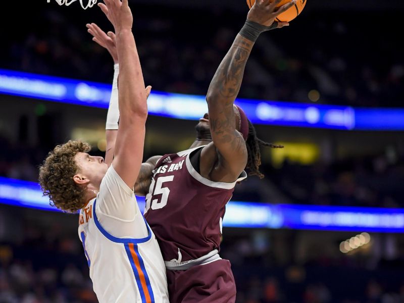 Mar 16, 2024; Nashville, TN, USA;  Texas A&M Aggies guard Manny Obaseki (35) shoots over Florida Gators center Micah Handlogten (3) during the first half at Bridgestone Arena. Mandatory Credit: Steve Roberts-USA TODAY Sports