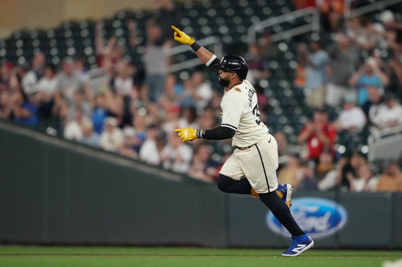 Sep 10, 2024; Minneapolis, Minnesota, USA; Minnesota Twins first baseman Carlos Santana (30) reacts to hitting a two-run home run during the fifth inning against the Los Angeles Angels at Target Field. Mandatory Credit: Jordan Johnson-Imagn Images