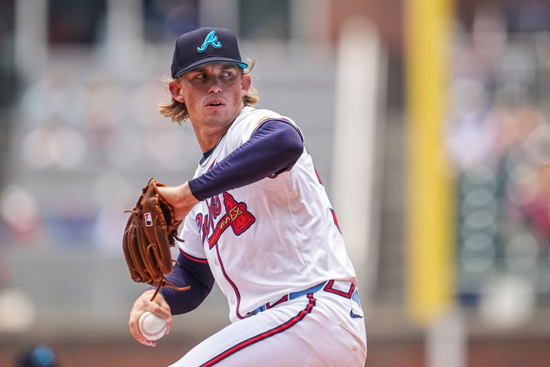 Jun 16, 2024; Cumberland, Georgia, USA; Atlanta Braves starting pitcher Hurston Waldrep (30) pitches against the Tampa Bay Rays during the first inning at Truist Park. Mandatory Credit: Dale Zanine-USA TODAY Sports