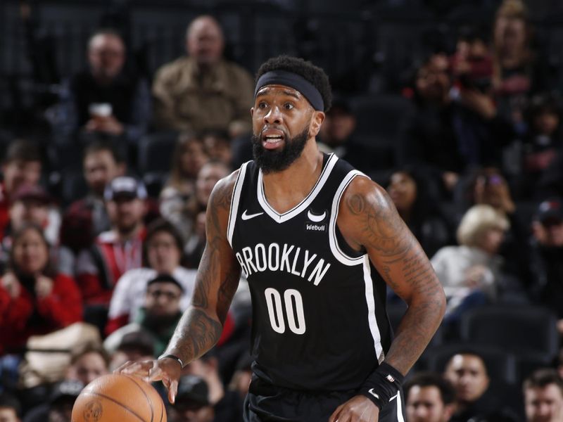 PORTLAND, OR - JANUARY 17: Royce O'Neale #00 of the Brooklyn Nets dribbles the ball during the game against the Portland Trail Blazers on January 17, 2024 at the Moda Center Arena in Portland, Oregon. NOTE TO USER: User expressly acknowledges and agrees that, by downloading and or using this photograph, user is consenting to the terms and conditions of the Getty Images License Agreement. Mandatory Copyright Notice: Copyright 2024 NBAE (Photo by Cameron Browne/NBAE via Getty Images)