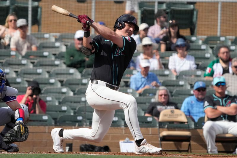 Feb 27, 2024; Salt River Pima-Maricopa, Arizona, USA; Arizona Diamondbacks right fielder Jake McCarthy (31) hits against the Texas Rangers during the first inning at Salt River Fields at Talking Stick. Mandatory Credit: Rick Scuteri-USA TODAY Sports