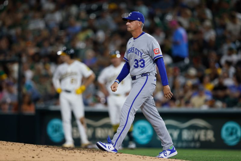 Sep 26, 2025; West Sacramento, California, USA; Kansas City Royals manager Matt Quatraro (33) walks to the mound for a pitching change during the fifth inning against the Athletics at Sutter Health Park. Mandatory Credit: Sergio Estrada-Imagn Images