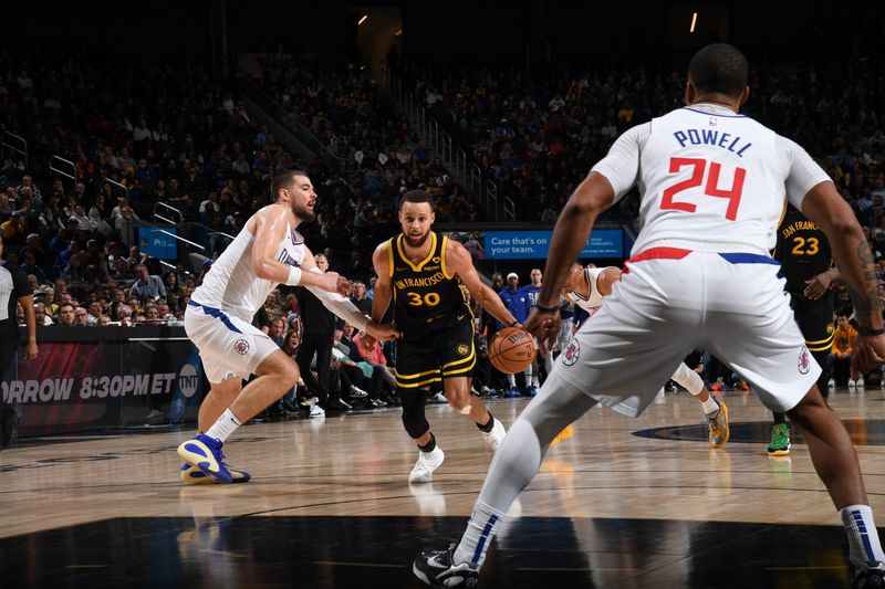 SAN FRANCISCO, CA - FEBRUARY 14: Stephen Curry #30 of the Golden State Warriors dribbles the ball during the game against the LA Clippers on FEBRUARY 14, 2024 at Chase Center in San Francisco, California. NOTE TO USER: User expressly acknowledges and agrees that, by downloading and or using this photograph, user is consenting to the terms and conditions of Getty Images License Agreement. Mandatory Copyright Notice: Copyright 2024 NBAE (Photo by Noah Graham/NBAE via Getty Images)