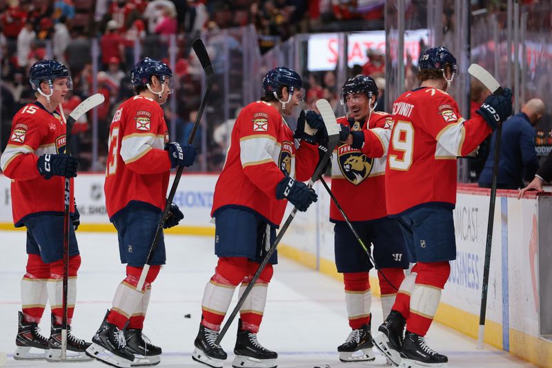 Nov 1, 2025; Sunrise, Florida, USA; Florida Panthers left wing Brad Marchand (63) celebrates with left wing Noah Gregor (18) after the game against the Dallas Stars at Amerant Bank Arena. Mandatory Credit: Sam Navarro-Imagn Images