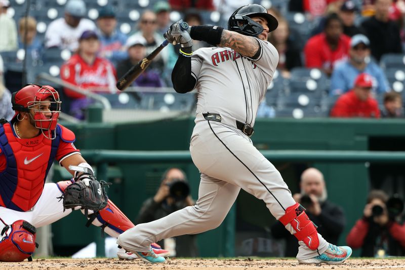 Apr 6, 2025; Washington, District of Columbia, USA; Arizona Diamondbacks catcher Jose Herrera (11) hits a home run during the second inning against the Washington Nationals at Nationals Park. Mandatory Credit: Daniel Kucin Jr.-Imagn Images