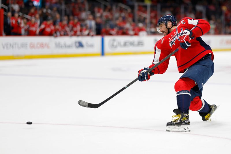 Oct 31, 2024; Washington, District of Columbia, USA; Washington Capitals left wing Alex Ovechkin (8) shoots the puck against the Montreal Canadiens in the third period at Capital One Arena. Mandatory Credit: Geoff Burke-Imagn Images