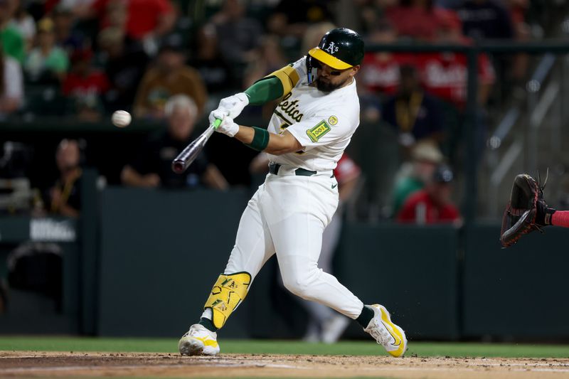 Sep 13, 2025; West Sacramento, California, USA; Athletics left fielder Carlos Cortes (26) hits a two-run home run against the Cincinnati Reds during the second inning at Sutter Health Park. Mandatory Credit: Dennis Lee-Imagn Images