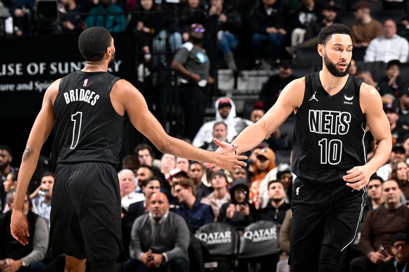 BROOKLYN, NY - FEBRUARY 8: Ben Simmons #10 high fives Mikal Bridges #1 of the Brooklyn Nets during the game against the Cleveland Cavaliers on February 8, 2024 at the Barclays Center in Brooklyn, New York. NOTE TO USER: User expressly acknowledges and agrees that, by downloading and/or using this Photograph, user is consenting to the terms and conditions of the Getty Images License Agreement. Mandatory Copyright Notice: Copyright 2024 NBAE (Photo by David Dow/NBAE via Getty Images)