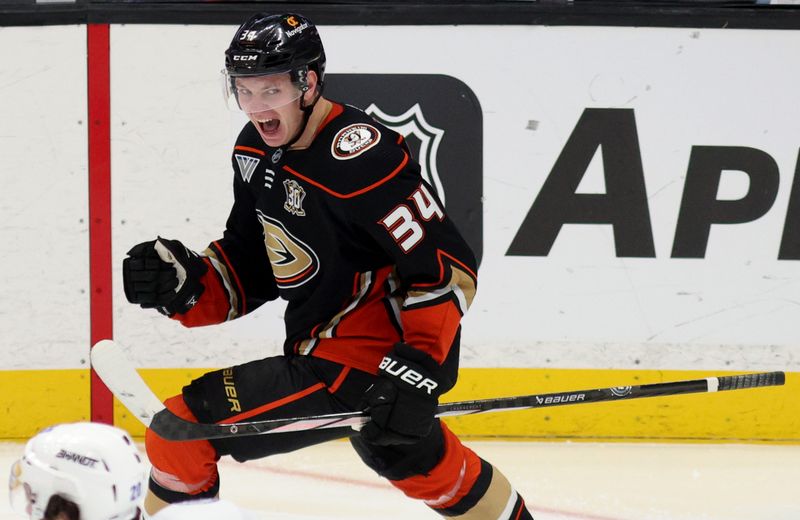 Mar 24, 2024; Anaheim, California, USA; Anaheim Ducks defenseman Pavel Mintyukov (34) reacts after a goal during the third period against the Tampa Bay Lightning at Honda Center. Mandatory Credit: Jason Parkhurst-USA TODAY Sports