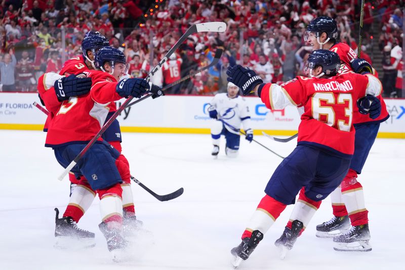 Apr 28, 2025; Sunrise, Florida, USA; Florida Panthers defenseman Seth Jones (3) celebrates with teammates after scoring against the Tampa Bay Lightning during the third period in game four of the first round of the 2025 Stanley Cup Playoffs at Amerant Bank Arena. Mandatory Credit: Rich Storry-Imagn Images