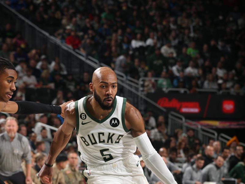 MILWAUKEE, WI -  NOVEMBER 2: Jevon Carter #5 of the Milwaukee Bucks drives to the basket during the game against the Detroit Pistons on November 2, 2022 at the Fiserv Forum Center in Milwaukee, Wisconsin. NOTE TO USER: User expressly acknowledges and agrees that, by downloading and or using this Photograph, user is consenting to the terms and conditions of the Getty Images License Agreement. Mandatory Copyright Notice: Copyright 2022 NBAE (Photo by Gary Dineen/NBAE via Getty Images).