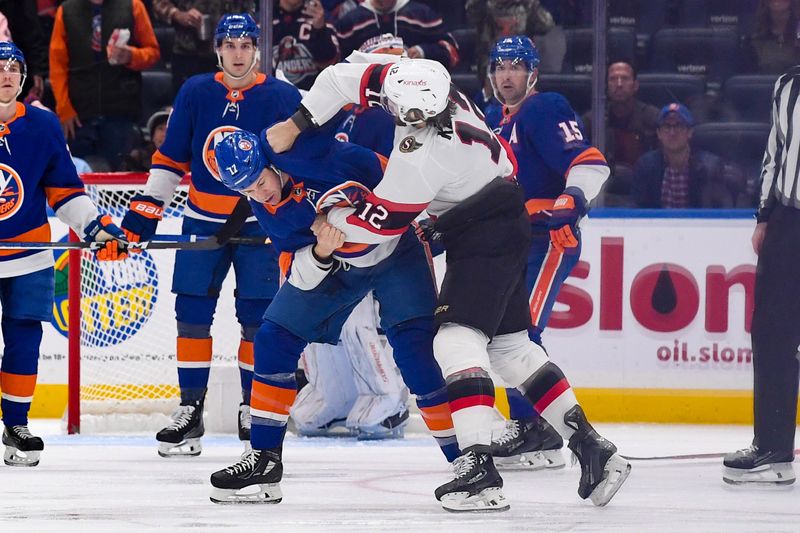 Oct 26, 2023; Elmont, New York, USA; New York Islanders left wing Matt Martin (17) and Ottawa Senators center Mark Kastelic (12) fight during the second period at UBS Arena. Mandatory Credit: Dennis Schneidler-USA TODAY Sports