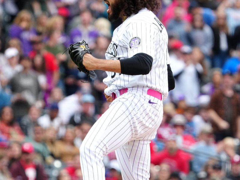 May 14, 2023; Denver, Colorado, USA; Colorado Rockies relief pitcher Justin Lawrence (61) celebrates defeating the against the Philadelphia Phillies in the ninth inning at Coors Field. Mandatory Credit: Ron Chenoy-USA TODAY Sports