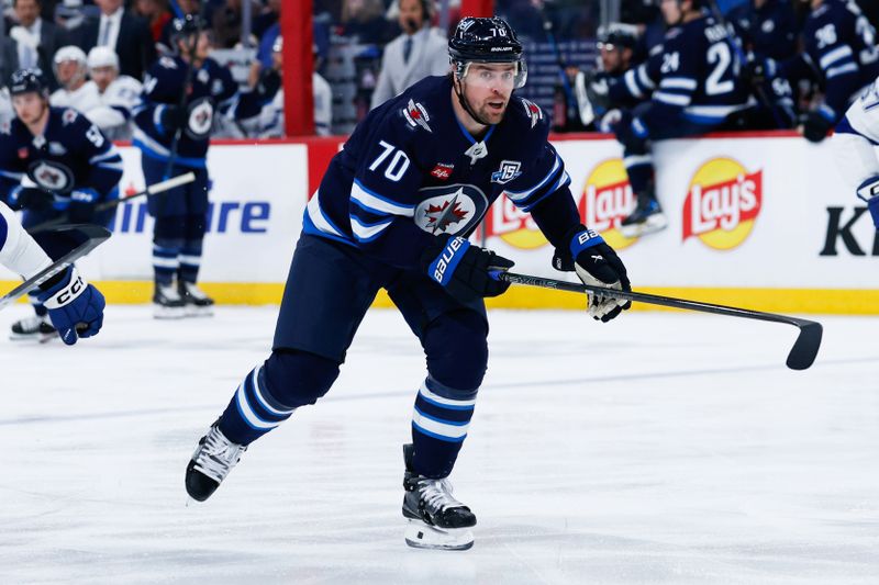 Mar 5, 2026; Winnipeg, Manitoba, CAN;  Winnipeg Jets forward Tanner Pearson (70) skates into the Tampa Bay Lightning zone during the second period at Canada Life Centre. Mandatory Credit: Terrence Lee-Imagn Images