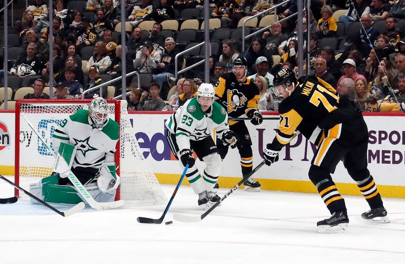 Oct 24, 2023; Pittsburgh, Pennsylvania, USA; Dallas Stars goaltender Jake Oettinger (29) and defenseman Esa Lindell (23) defend Pittsburgh Penguins center Evgeni Malkin (71) during the third period at PPG Paints Arena. Dallas won 4-1. Mandatory Credit: Charles LeClaire-USA TODAY Sports