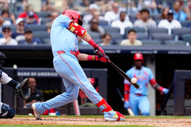 Aug 31, 2024; Bronx, New York, USA; St. Louis Cardinals left fielder Lars Nootbaar (21) hits a double against the New York Yankees during the sixth inning at Yankee Stadium. Mandatory Credit: Gregory Fisher-USA TODAY Sports