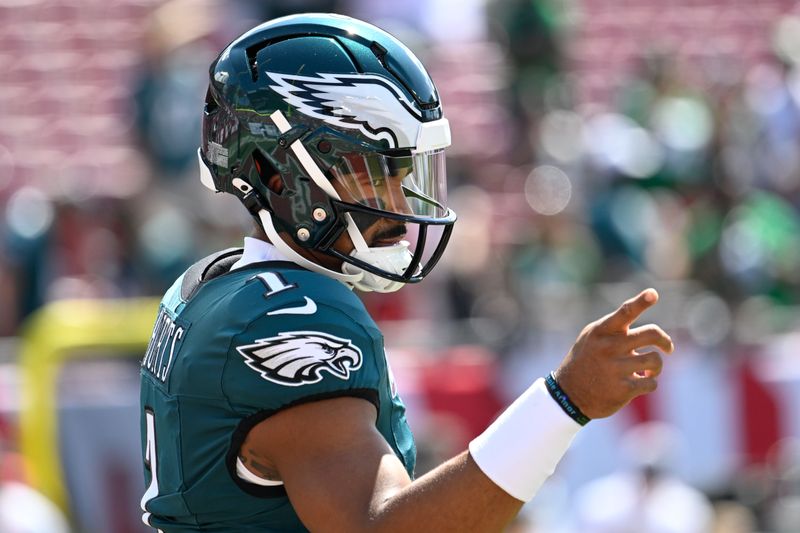 Philadelphia Eagles' Jalen Hurts reacts before an NFL football game against the Tampa Bay Buccaneers, Sunday, Sept. 29, 2024, in Tampa, Fla. (AP Photo/Jason Behnken)