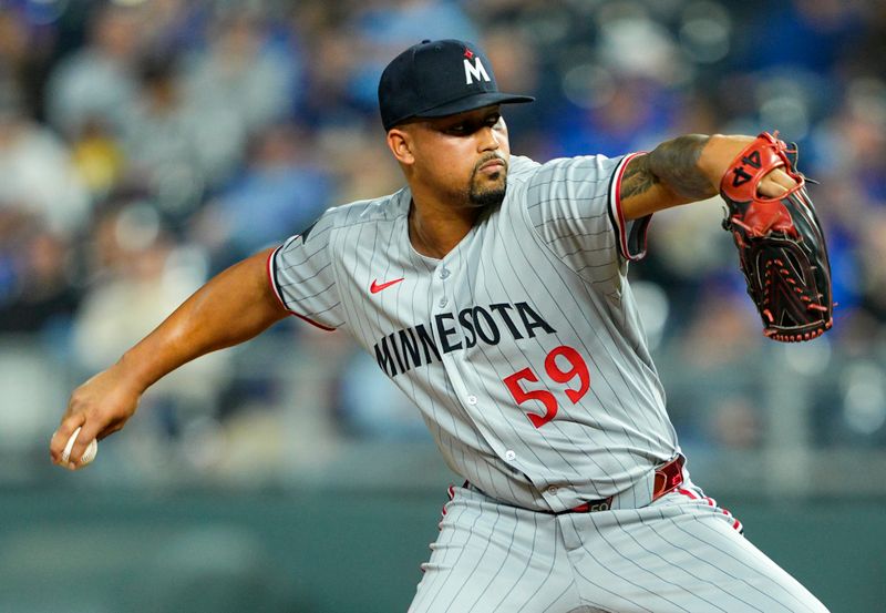 Apr 9, 2025; Kansas City, Missouri, USA; Minnesota Twins relief pitcher Jhoan Duran (59) pitches during the ninth inning against the Kansas City Royals at Kauffman Stadium. Mandatory Credit: Jay Biggerstaff-Imagn Images