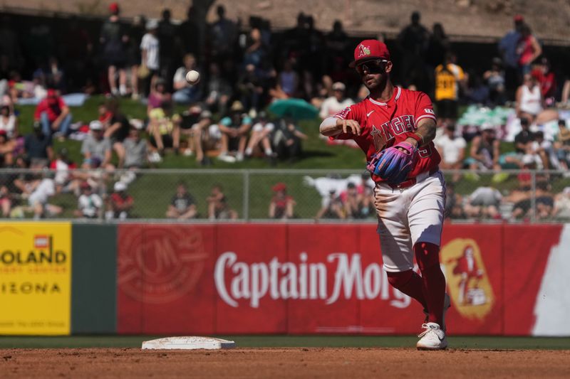 Mar 13, 2026; Tempe, Arizona, USA; Los Angeles Angels shortstop Zach Neto (9) fields the ball against the Cleveland Guardians in the third inning at Tempe Diablo Stadium. Mandatory Credit: Rick Scuteri-Imagn Images