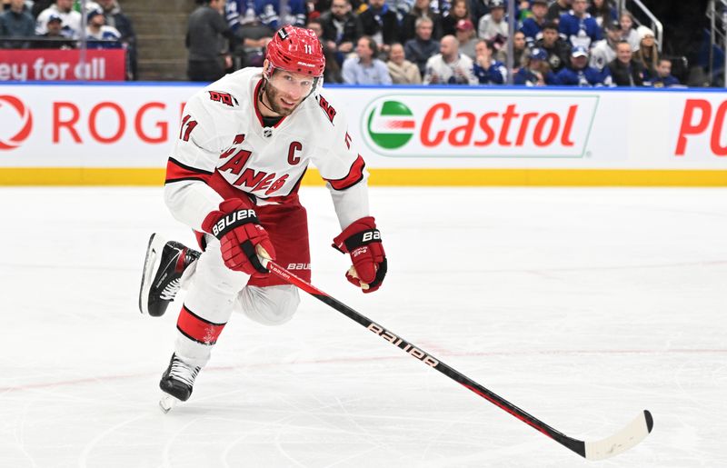 Dec 30, 2023; Toronto, Ontario, CAN; Carolina Hurricanes forward Jordan Staal (11) pursues the play against the Toronto Maple Leafs in the second period at Scotiabank Arena. Mandatory Credit: Dan Hamilton-USA TODAY Sports