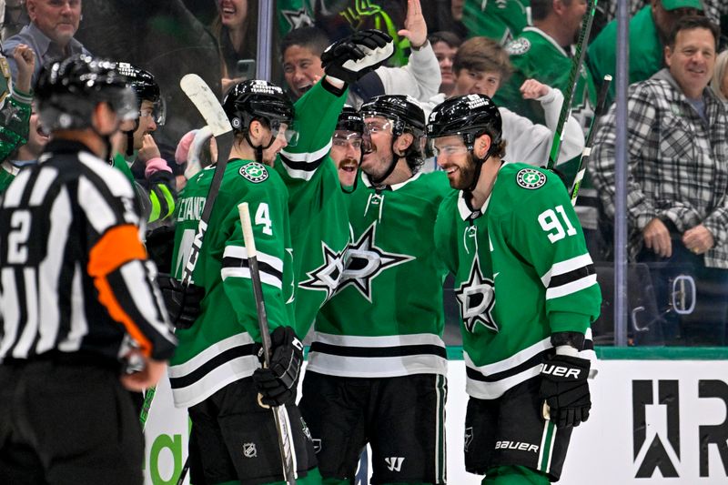 Dec 1, 2024; Dallas, Texas, USA; Dallas Stars defenseman Miro Heiskanen (4) and center Matt Duchene (95) and left wing Mason Marchment (27) and center Tyler Seguin (91) celebrate after Marchment scores the game winning goal against the Winnipeg Jets during the third period at the American Airlines Center. Mandatory Credit: Jerome Miron-Imagn Images