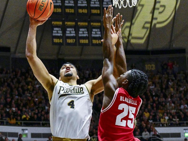 Feb 15, 2025; West Lafayette, Indiana, USA; Purdue Boilermakers forward Trey Kaufman-Renn (4) shoots the ball over Wisconsin Badgers guard John Blackwell (25) during the second half at Mackey Arena. Mandatory Credit: Marc Lebryk-Imagn Images