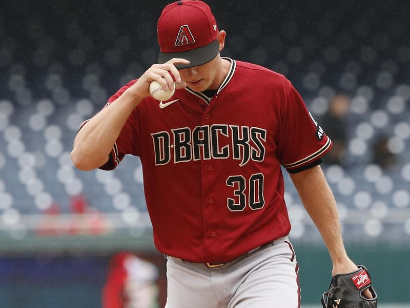 Jun 22, 2023; Washington, District of Columbia, USA; Arizona Diamondbacks relief pitcher Scott McGough (30) walks onto the mound during the ninth inning against the Washington Nationals at Nationals Park. Mandatory Credit: Amber Searls-USA TODAY Sports