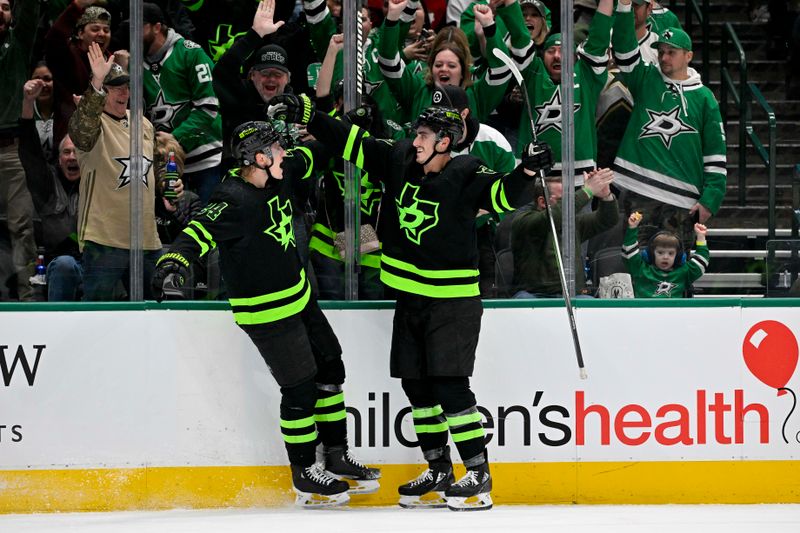 Jan 10, 2024; Dallas, Texas, USA; Dallas Stars center Roope Hintz (24) and left wing Mason Marchment (27) celebrates a goal scored by Hintz against the Minnesota Wild during the second period at the American Airlines Center. Mandatory Credit: Jerome Miron-USA TODAY Sports