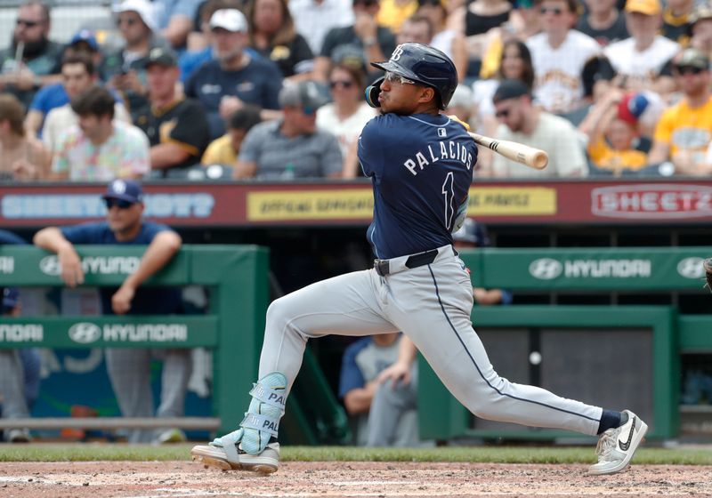 Jun 23, 2024; Pittsburgh, Pennsylvania, USA;  Tampa Bay Rays second baseman Richie Palacios (1) hits a RBI single against the Pittsburgh Pirates during the eighth inning at PNC Park. Tampa Bay won 3-1. Mandatory Credit: Charles LeClaire-USA TODAY Sports