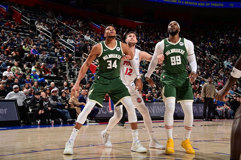 DETROIT, MI - JANUARY 22: Giannis Antetokounmpo #34 and Jae Crowder #99 of the Milwaukee Bucks waits for the rebound during the game against the Detroit Pistons on January 22, 2024 at Little Caesars Arena in Detroit, Michigan. NOTE TO USER: User expressly acknowledges and agrees that, by downloading and/or using this photograph, User is consenting to the terms and conditions of the Getty Images License Agreement. Mandatory Copyright Notice: Copyright 2024 NBAE (Photo by Chris Schwegler/NBAE via Getty Images)