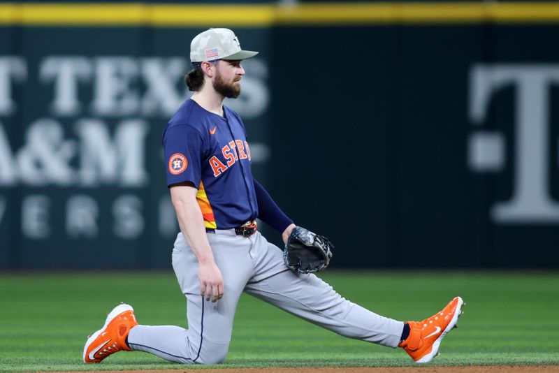 May 18, 2025; Arlington, Texas, USA; Houston Astros second base Brendan Rodgers (1) kneels during a timeout in the the game against the Texas Rangers at Globe Life Field. Mandatory Credit: Tim Heitman-Imagn Images