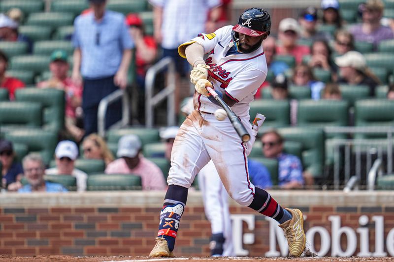 Apr 23, 2025; Cumberland, Georgia, USA; Atlanta Braves outfielder Michael Harris II (23) breaks his bat while hitting a single against the St. Louis Cardinals during the fifth inning at Truist Park. Mandatory Credit: Dale Zanine-Imagn Images