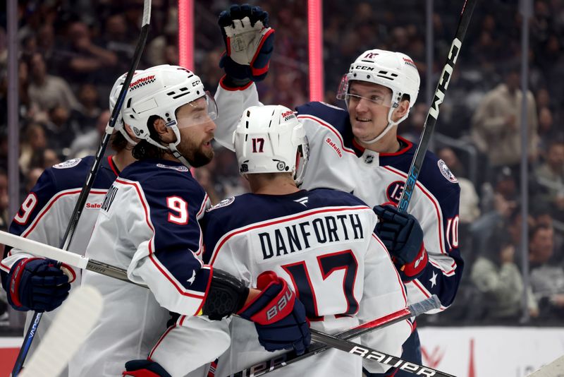 Nov 9, 2024; Los Angeles, California, USA; Columbus Blue Jackets defenseman Ivan Provorov (9) celebrates with right wing Justin Danforth (17) and left wing Dmitri Voronkov (10) after scoring during the third period against the Los Angeles Kings at Crypto.com Arena. Mandatory Credit: Jason Parkhurst-Imagn Images