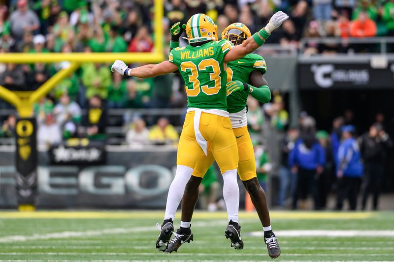 Oct 21, 2023; Eugene, Oregon, USA; Oregon Ducks defensive back Evan Williams (33) celebrates during the third quarter against the Washington State Cougars at Autzen Stadium. Mandatory Credit: Craig Strobeck-USA TODAY Sports