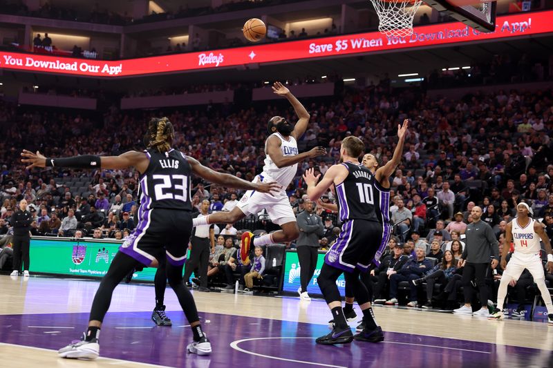 SACRAMENTO, CALIFORNIA - APRIL 02: James Harden #1 of the LA Clippers is fouled as he goes up for a shot against the Sacramento Kings in the first half at Golden 1 Center on April 02, 2024 in Sacramento, California. NOTE TO USER: User expressly acknowledges and agrees that, by downloading and or using this photograph, User is consenting to the terms and conditions of the Getty Images License Agreement.  (Photo by Ezra Shaw/Getty Images)